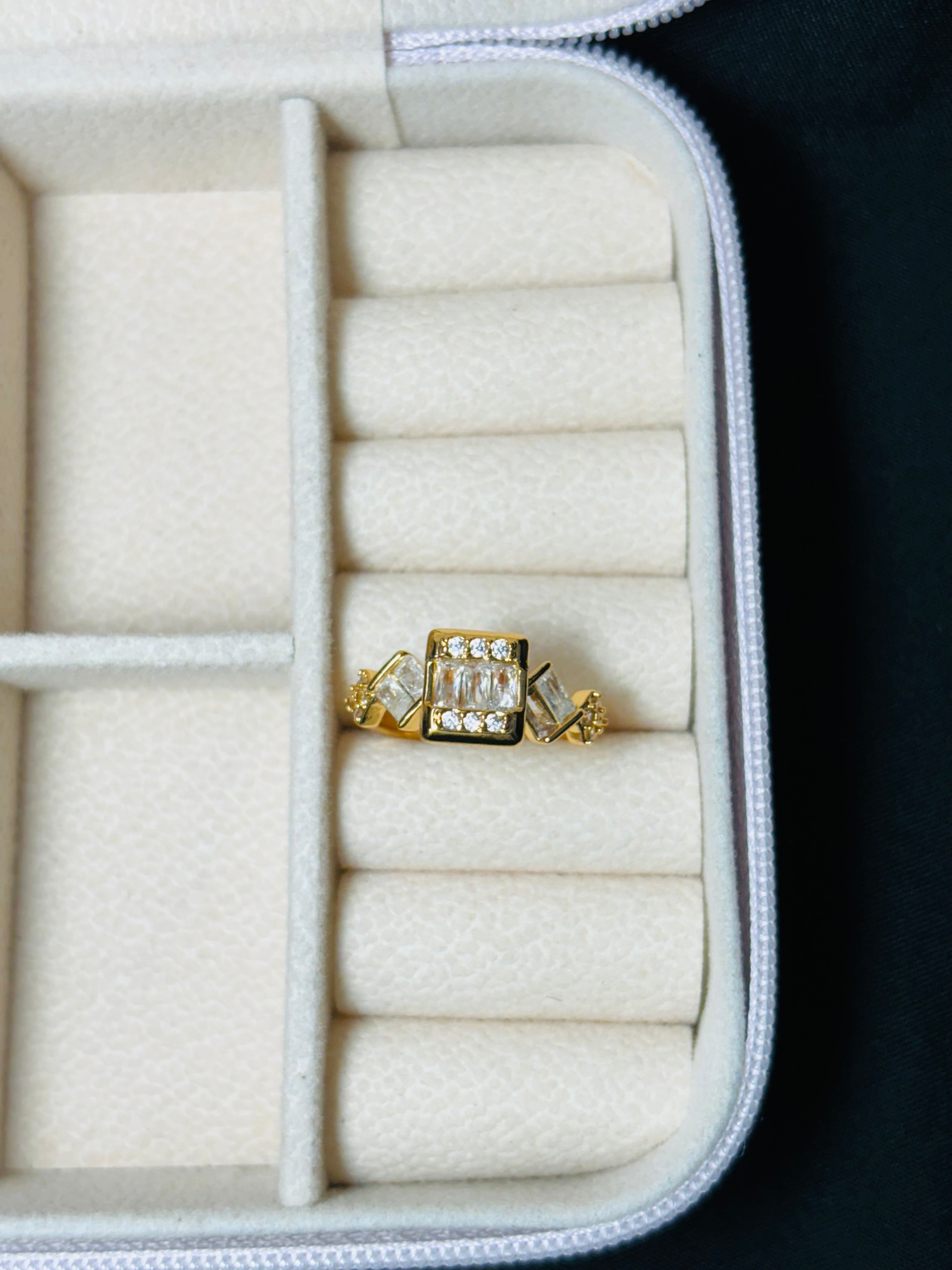 Gold colour square and oval shaped ring