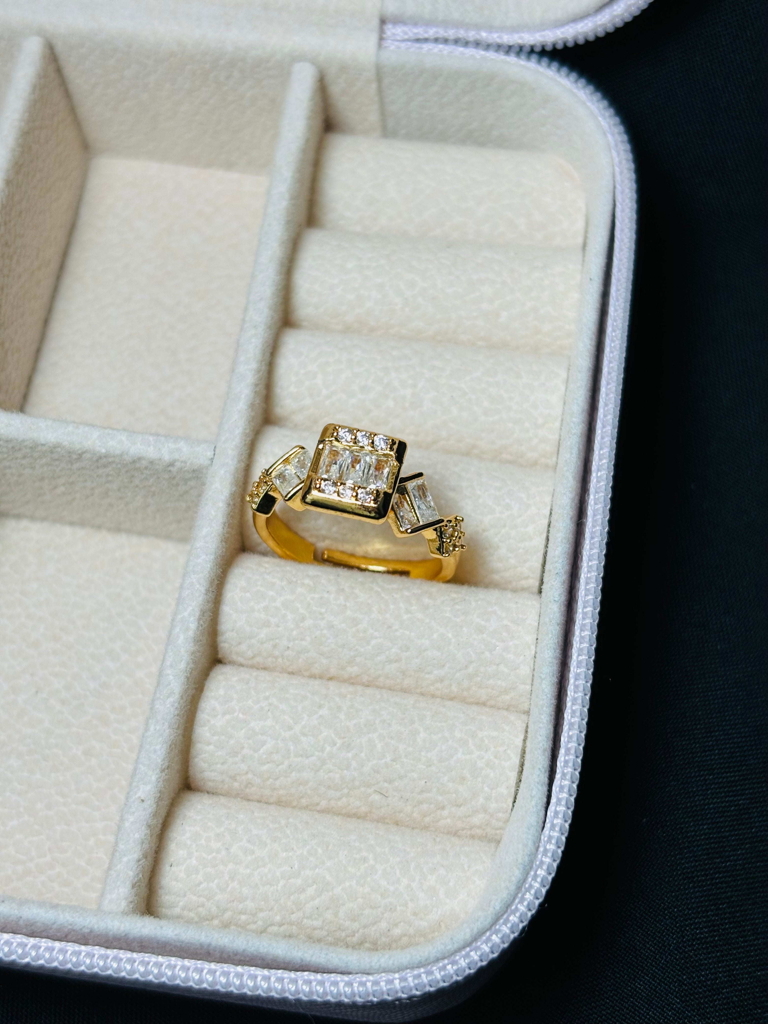 Gold colour square and oval shaped ring